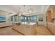 Open kitchen and dining area with island and views to the outside at 612 Mourning Dove Dr, Sarasota, FL 34236