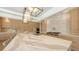 Spacious kitchen showcases a large island, modern lighting, and a high-end range at 612 Mourning Dove Dr, Sarasota, FL 34236