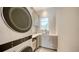 The laundry room has a sink, cabinets, and a stackable washer and dryer at 612 Mourning Dove Dr, Sarasota, FL 34236