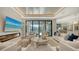Bright living room with fireplace, large windows, and neutral decor at 612 Mourning Dove Dr, Sarasota, FL 34236