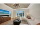 Stylish living room with a ceiling design, modern fixtures, and water views at 612 Mourning Dove Dr, Sarasota, FL 34236