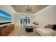 Comfortable living room with modern decor, a decorative ceiling, and a water view at 612 Mourning Dove Dr, Sarasota, FL 34236