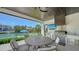 Stunning outdoor kitchen with stainless steel grill and waterfront views, perfect for entertaining at 612 Mourning Dove Dr, Sarasota, FL 34236