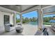Covered outdoor patio overlooking the pool and canal, perfect for entertaining and relaxation at 612 Mourning Dove Dr, Sarasota, FL 34236