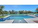 Inviting pool with a spillover spa and scenic waterfront surroundings at 612 Mourning Dove Dr, Sarasota, FL 34236