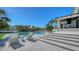 Resort-style pool with water views, patio area, and modern outdoor furniture at 612 Mourning Dove Dr, Sarasota, FL 34236