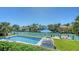 Beautiful waterfront pool with dock and lift in a luxurious backyard at 612 Mourning Dove Dr, Sarasota, FL 34236