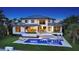 Beautiful backyard features a pool, spa, and outdoor seating area, offering a luxurious outdoor experience at 612 Mourning Dove Dr, Sarasota, FL 34236