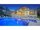 Elegant two-story home with a pool, spa, and covered patio perfect for entertaining at 612 Mourning Dove Dr, Sarasota, FL 34236