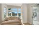 This room has a tan sofa and a lovely view of the waterfront at 612 Mourning Dove Dr, Sarasota, FL 34236