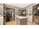 Spacious walk-in closet with custom shelving and storage for clothes, shoes, and accessories at 612 Mourning Dove Dr, Sarasota, FL 34236