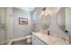 An elegant bathroom showcases double sinks, marble countertops, and a glass-enclosed shower at 630 De Narvaez Dr, Longboat Key, FL 34228