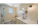 Elegant bathroom with a framed mirror, updated vanity, and glass-enclosed shower at 630 De Narvaez Dr, Longboat Key, FL 34228