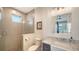 Contemporary bathroom featuring a glass-enclosed shower, stylish vanity, and modern lighting at 630 De Narvaez Dr, Longboat Key, FL 34228