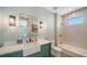 Charming bathroom featuring a stylish vanity, soaking tub, and modern finishes at 630 De Narvaez Dr, Longboat Key, FL 34228