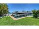 Waterfront property boasts a private boat dock, enhancing coastal living with direct water access and stunning neighborhood views at 630 De Narvaez Dr, Longboat Key, FL 34228