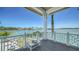 Charming deck with seating, providing captivating water views and a serene outdoor escape at 630 De Narvaez Dr, Longboat Key, FL 34228