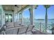 Inviting outdoor deck with comfortable seating and great views of the beautiful waterfront location at 630 De Narvaez Dr, Longboat Key, FL 34228