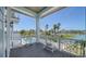 Enjoy the pool view from this home's covered deck, a perfect spot for relaxation and entertainment at 630 De Narvaez Dr, Longboat Key, FL 34228