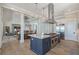 Spacious kitchen features a large island with a cooktop and stainless-steel appliances at 630 De Narvaez Dr, Longboat Key, FL 34228