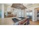 Spacious kitchen features a large island with a cooktop, stainless-steel appliances, and an open layout at 630 De Narvaez Dr, Longboat Key, FL 34228