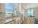 Bright kitchen features an undermount sink, stainless steel appliances, and water views at 630 De Narvaez Dr, Longboat Key, FL 34228