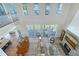 Sun-soaked open-concept living room with fireplace, wood floors, and access to the deck at 630 De Narvaez Dr, Longboat Key, FL 34228