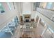 Open concept living room with high ceilings, fireplace, and access to outdoor living spaces at 630 De Narvaez Dr, Longboat Key, FL 34228