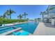 Backyard pool and spa on a gorgeous blue home with waterfront access at 630 De Narvaez Dr, Longboat Key, FL 34228