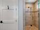 Modern bathroom with a walk-in shower with neutral tile, dual shower heads, and niche at 630 De Narvaez Dr, Longboat Key, FL 34228