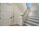 Elegant staircase with wood treads, white risers, and a stylish banister at 630 De Narvaez Dr, Longboat Key, FL 34228