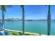 Breathtaking water view with palm trees framing the serene waterfront landscape at 630 De Narvaez Dr, Longboat Key, FL 34228