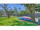 Several kayaks neatly stacked in the back yard at 630 De Narvaez Dr, Longboat Key, FL 34228