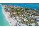 Expansive aerial view showcasing beachside homes near the ocean, embodying the coastal lifestyle at 645 Liberty St, Englewood, FL 34223