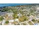 Aerial shot of a residential neighborhood with a view of the coastline and ocean in the distance at 645 Liberty St, Englewood, FL 34223