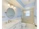 Bathroom featuring a tub with shower, tiled wall, and white marble countertop sink at 645 Liberty St, Englewood, FL 34223