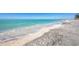 Beautiful beach with turquoise water and white sand, showcasing a tranquil coastal setting at 645 Liberty St, Englewood, FL 34223