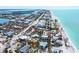 Breathtaking aerial shot of the coastline featuring luxurious homes, serene beaches, and azure waters at 645 Liberty St, Englewood, FL 34223
