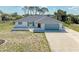 Charming single-story home featuring a well-maintained yard and an attached two-car garage at 645 Liberty St, Englewood, FL 34223