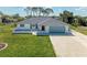 Charming single-story home with attached garage, manicured lawn and updated roof at 645 Liberty St, Englewood, FL 34223