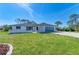 Well-maintained one-story home with manicured lawn, attached garage and modern upgrades at 645 Liberty St, Englewood, FL 34223