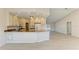 Modern kitchen featuring granite countertops, a breakfast bar, and stainless-steel appliances at 645 Liberty St, Englewood, FL 34223