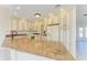 Gourmet kitchen with granite countertops, stainless steel appliances, and custom cabinetry at 645 Liberty St, Englewood, FL 34223