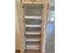 View of a pantry with multiple sliding shelves inside of it at 645 Liberty St, Englewood, FL 34223