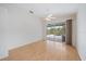 Bright bedroom with hardwood floors and sliding glass door with pool view at 6552 Meandering Way, Lakewood Ranch, FL 34202