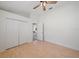 Bright bedroom showing wood-look floors, double closet doors, and open doorway at 6552 Meandering Way, Lakewood Ranch, FL 34202