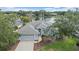 Charming single-Gathering home with a well-manicured lawn, mature trees, and a peaceful lake view at 6552 Meandering Way, Lakewood Ranch, FL 34202