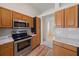 The kitchen featuring stainless steel appliances and tile backsplash at 6552 Meandering Way, Lakewood Ranch, FL 34202