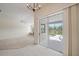 Open concept living room with view to pool, lanai, and lake at 6552 Meandering Way, Lakewood Ranch, FL 34202