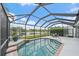 Beautiful screened-in pool overlooking a tranquil lake creating a serene oasis for relaxation and recreation at 6552 Meandering Way, Lakewood Ranch, FL 34202